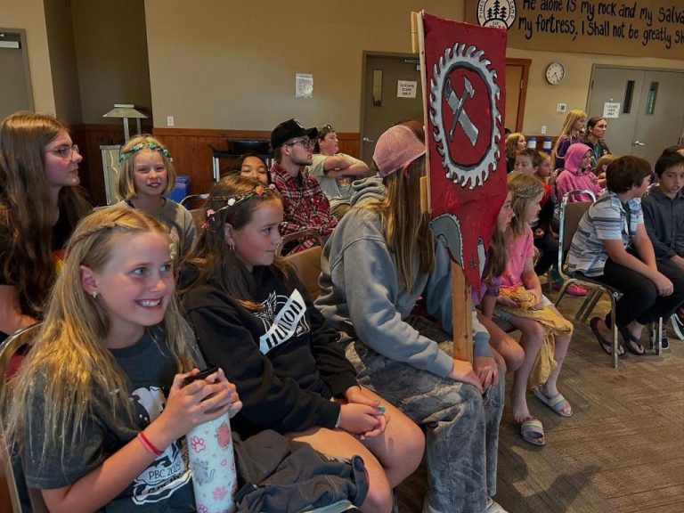 kids at a camp assembly
